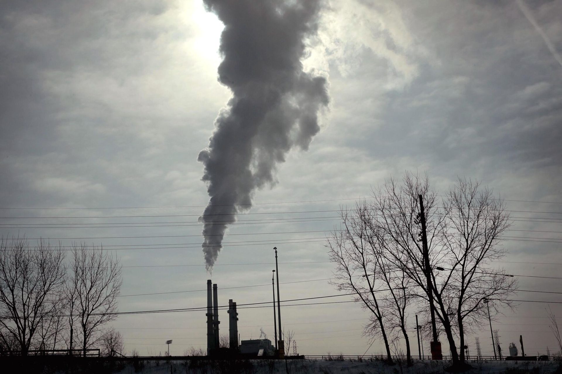 Smokestack billowing smoke into the air; Credit: Getty Images